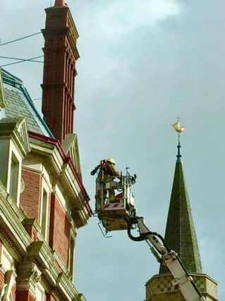 Firefighters inspect potential Storm Doris damage at the Town Hall. Photo by Dave Lee SUS-170223-142826001