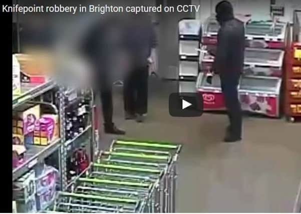 Two men robbed the store of Â£2,500 at knifepoint