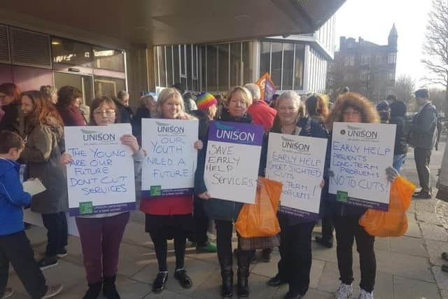 Protestors outside the budget meeting at Hove Town Hall SUS-170223-183043001