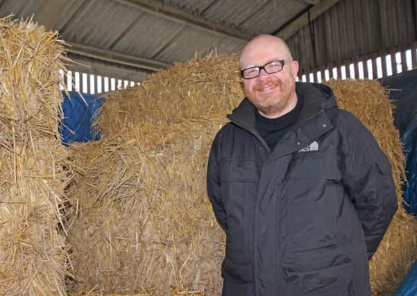 Cllr Fitzgerald with straw bales