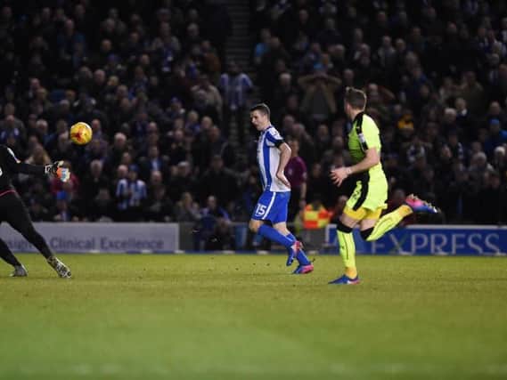 Brighton & Hove Albion's Jamie Murphy clips the ball over Reading goalkeeper Ali Al Habsi to put his side 2-0 up. Picture by PW Sporting Pics