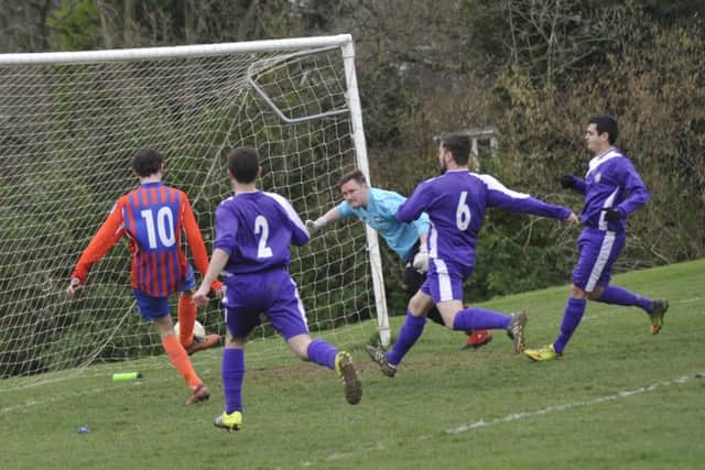 Dean Boyd taps in to open the scoring at Battle Rec on Saturday.