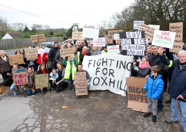Almost a hundred residents came together with banners and posters in Fox Hill on Saturday (February 25) to fight against the three major developments proposed for the town. Picture: Derek Martin