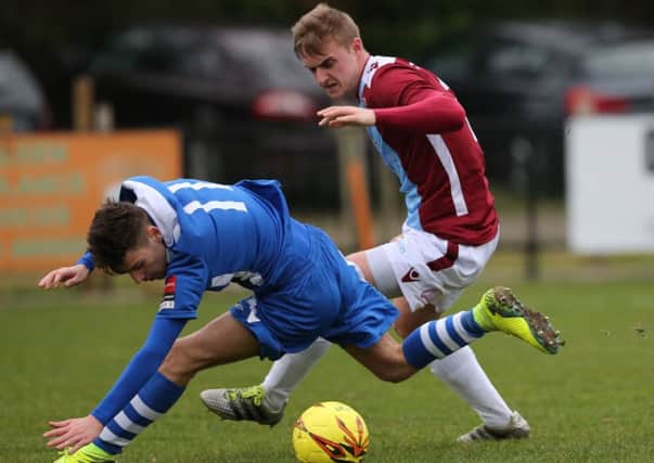 Callum Emptage tussles for possession during Hastings United's 2-2 draw at home to Chatham Town on Saturday. Picture courtesy Scott White
