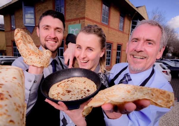 Alex Brakell, Jane Kendall and Andy Macauley flipping pancakes. Picture: Lea Graham Associates