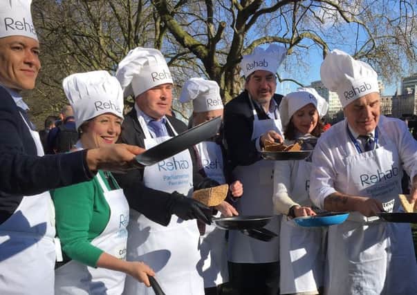 Tim with other competitors at the Rehab Parliamentary Pancake Race
