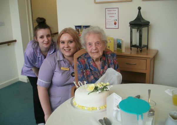 Margaret with Green Willow Care Home staff