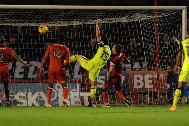 Jordan Moore-Taylor scores Exeter's second goal.

Picture by Jon Rigby