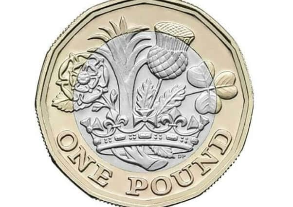 The new Â£1 coin will come into circulation at the end of March. All existing Â£1 coins must be spent or banked by October 31.
CAPTION: The new Â£1 coin will come into circulation at the end of March PPP-170220-154602001