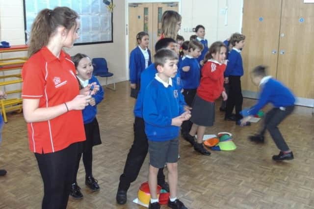 The sports leaders working with the schoolpupils