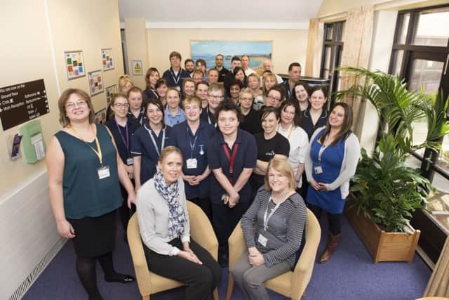 Staff at Milton Grange celebrate their 'outstanding' rating by the Care Quality Commission