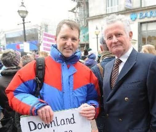 Simon Boyle with councillor Robert Smart at the march on Saturday. Photo Jon Rigby SUS-170103-171332001