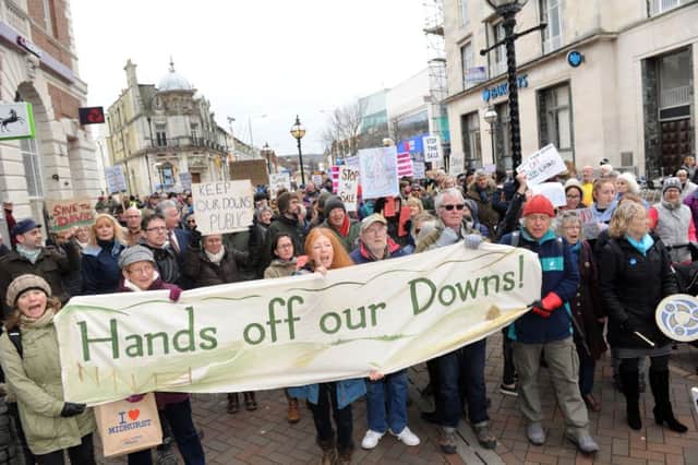 Demonstrators in Eastbourne protesting against the proposed sale of 3,000 acres of downland (Photo by Jon Rigby) SUS-170227-114230008