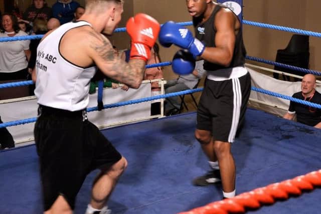 Danny Motton and Tando Dwyer line each other up in one of the senior bouts. Picture courtesy Sid Saunders