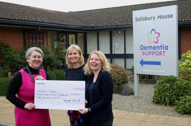 Ursula Watt, George Ide LLP partner and head of the firms private client department, presents a cheque for Â£3,790 to Dementia Supports Sabine Margarson, trustee and project director, and Becky Stotesbury, head of fundraising
