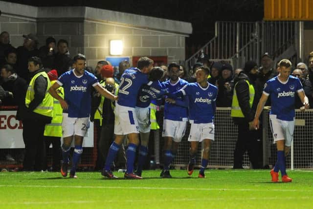 Portsmouth players celebrate their first goal.
Pictures by JON RIGBY