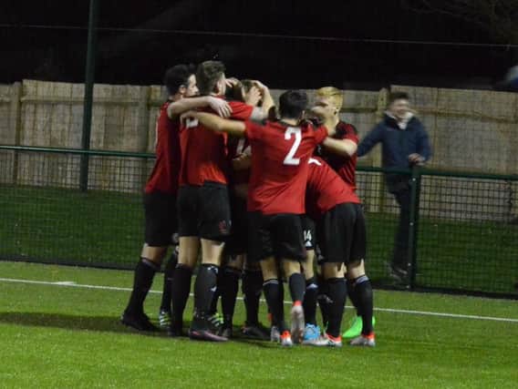 Heath celebrate the winning goal. Picture by Grahame Lehkyj