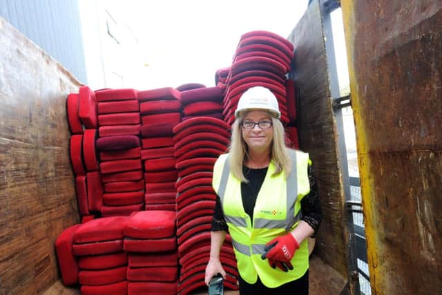 Columnist Annemarie Field and a stack of the theatre's seats