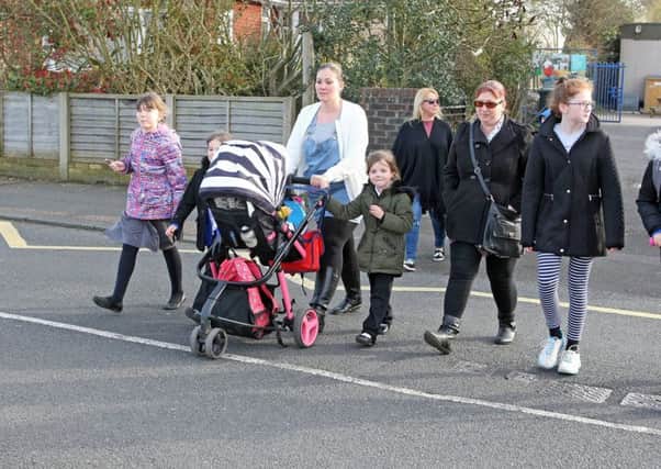 Charlotte Melhuish, ten, (right) with her mother Jayne and others crossing Salvington Road. Pictures: Derek Martin