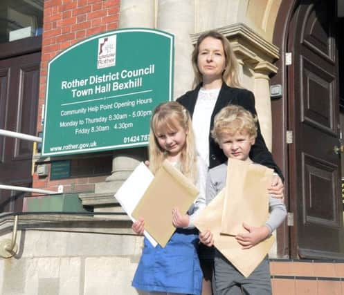 Helen Eckersley handed the petition to Rother District Council with her children Lily and Daniel. Photo by James Eckersley SUS-170803-151120001