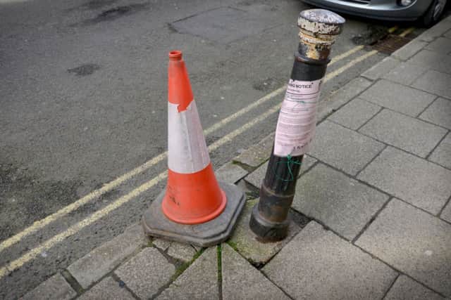 The bollard has a planning notice on. SUS-170803-173041001