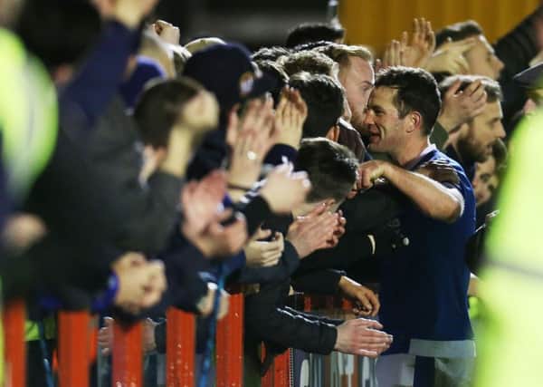 Michael Doyle celebrates Pompey's win against Crawley with the Blues supporters Picture: Joe Pepler