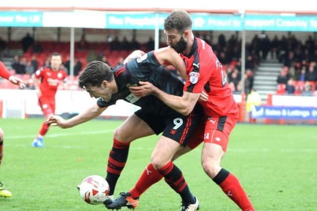 Joe McNerney battles for the ball with Doncaster's John Marquis.
Picture by STEVE ROBSARDS