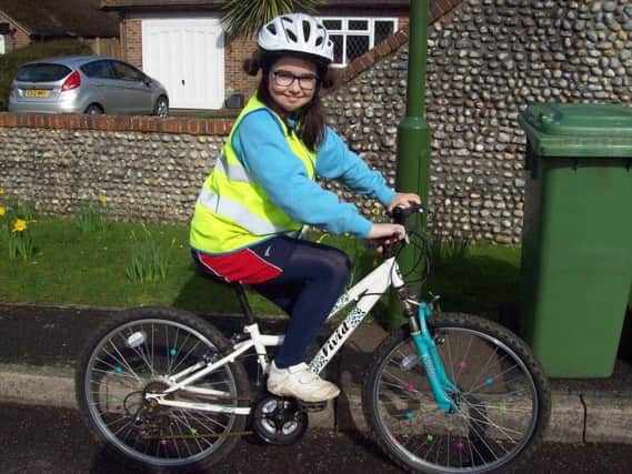 A pupil on her bike