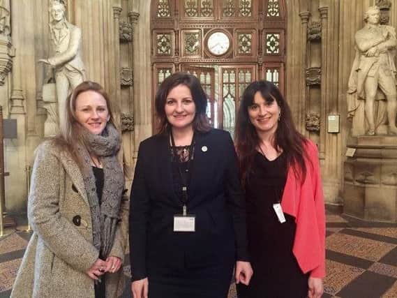 Leanna (left) with Caroline Ansell MP and Becky Whippy of Embrace