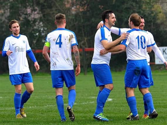 Adam Kneller celebrates after netting Shoreham's third goal at Wick on Saturday. Picture by Stephen Goodger