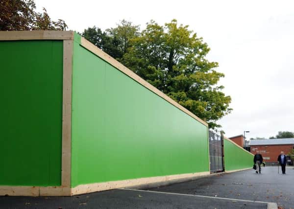 The 'Waitrose' site remains behind green hoarding