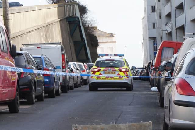 Police have taped off Undercliff, St Leonards. Photo by Dave Johnson SUS-170313-120540001