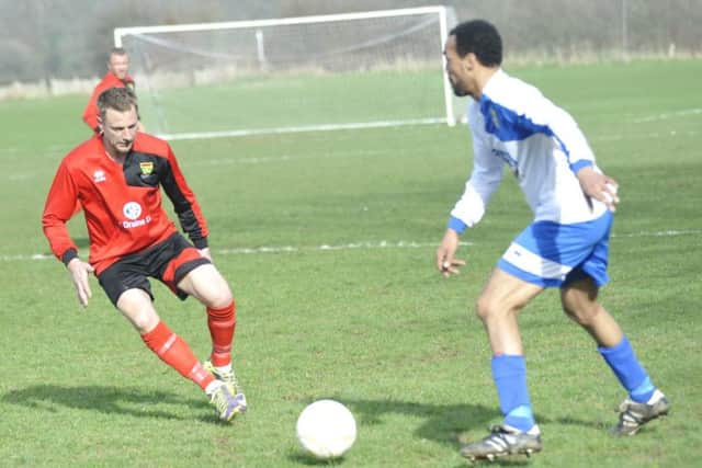 A Sedlescombe Rangers player assesses his options against Bexhill AAC.