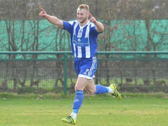 Max Miller celebrates the winner against Crawley Down Gatwick. Picture by Grahame Lehkyj