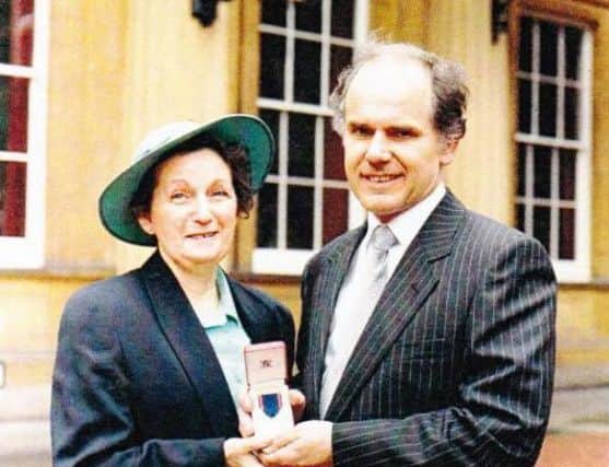 David Skerritt with his wife Patricia at Buckingham Palace in 1991, picking up his Royal Victorian Medal for services to the royal family. Mr Skerritt worked for Radio Rentals and installed televisions for members of the royal family.