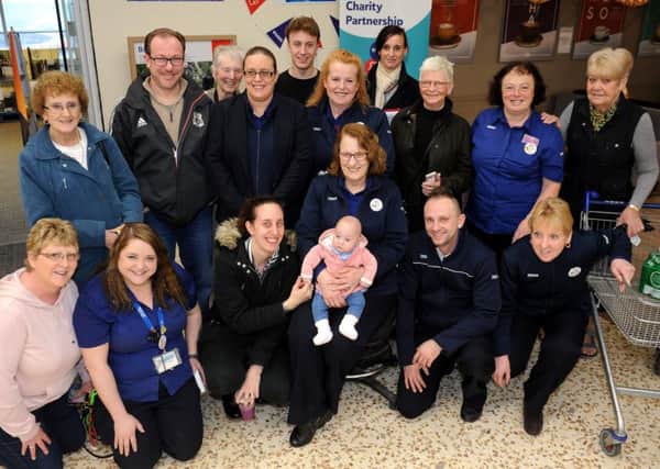 Mum Teresa Thomas with supporters at Tesco Extra in Chichester. Picture: Steve Robards SR1704832