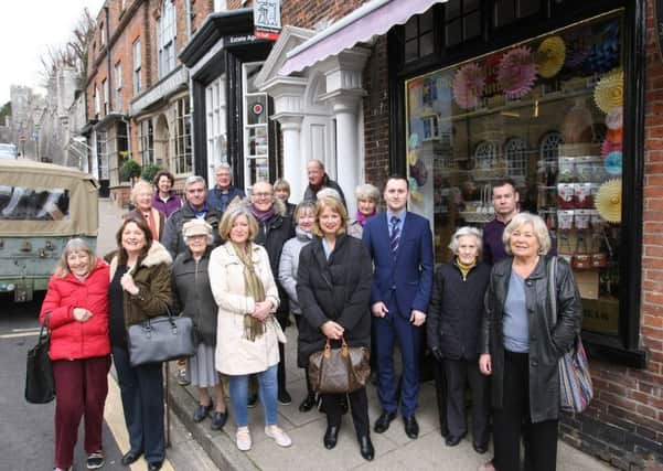 Residents gathered in High Street where the pharmacy used to be to show their support for the campaign. Picture: Derek Martin SUS-170314-145057008