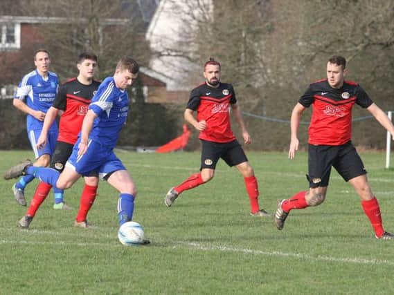 Action from Lancing United's clash at Cowfold on Saturday. Picture by Derek Martin DM17311850