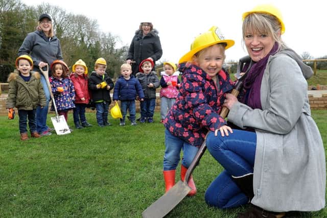 Children and staff dig for the new Thakeham Pre-school building, Eryn Varkala and Sharon Rance in the foreground. Pic Steve Robards  SR1704735 SUS-170803-153938001