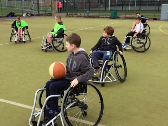 The pupils take part in wheelchair basketball activities