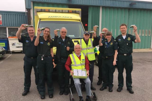 The Littlehampton Lions have donated sponge ambulance toys to the local ambulance station in East Street. Pictured (centre) are John Taylor, 79, and Norman Blackmore, 85 from the Lions group and paramedics, including Brett Walford, 47 (far left) and Paul Harris (third from right).