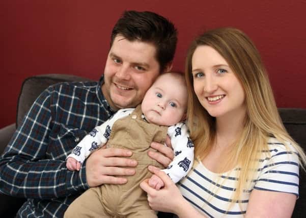 Charlotte and William Parker with seven-month-old Lewis. Picture: Derek Martin