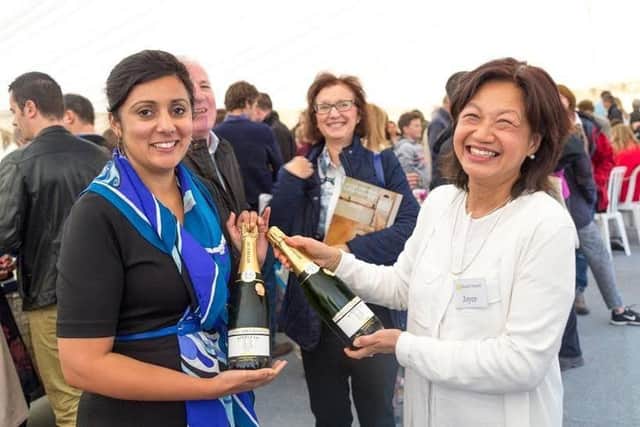 MP Nus Ghani (left) meets owner Joyce Tay during a recent visit to Bluebell Vineyard Estates