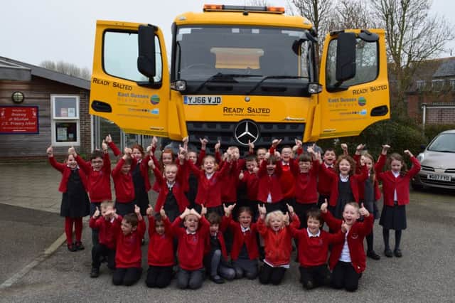 Little ones from Pevensey and Westham School with one of the new ESCC gritters SUS-170315-164450001