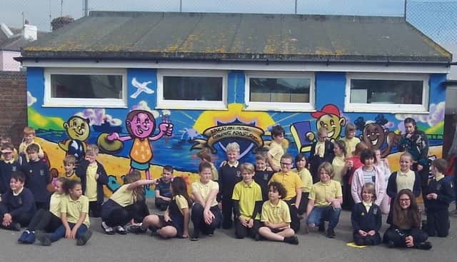 Pupils at All Saints with their mural