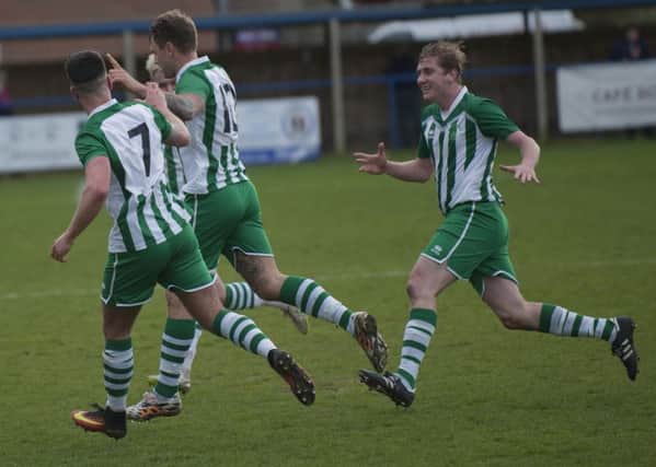 Goal celebration time for City at Haywards Heath / Picture by Tommy McMillan