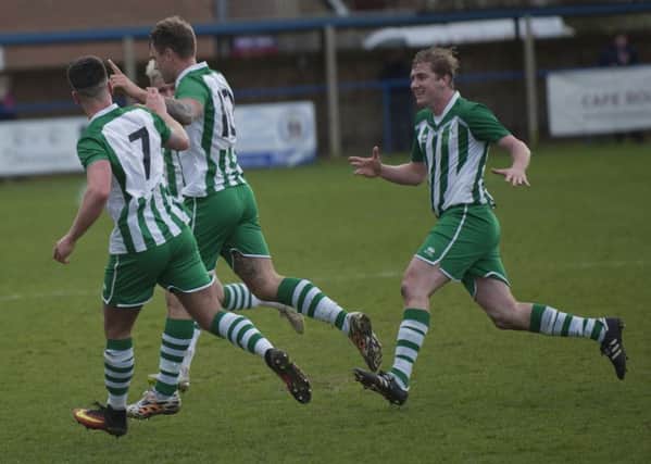 City celebrate a goal at Haywards Heath / Picture by Tommy McMillan