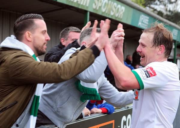 James Fraser celebrates one of his goals with fans / Picture by Kate Shemilt