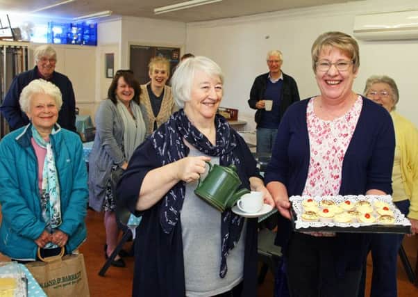 Sandra Boxall (left), 73, and Pauline Cunningham, 60, with customers. Picture: Derek Martin