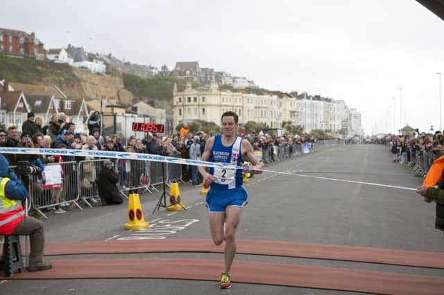Ben Fish crosses the line to win the 2017 Hastings Half Marathon. Picture courtesy Frank Copper